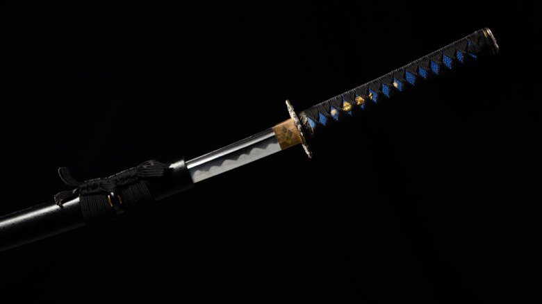 Japanese katana samurai sword hang in air over Black background isolated.